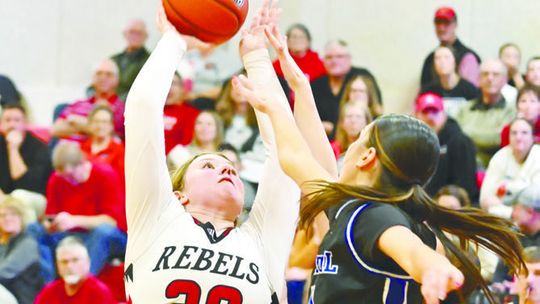REBELS BATTLE PAST WILDCATS